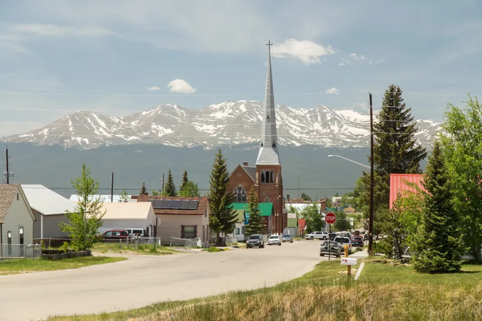 Church with tall steeple in rural Colorado.